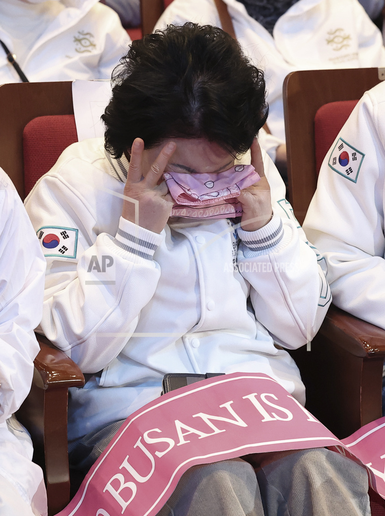 A South Korean supporter weeps after the South Korean city of Busan failed to win the right to host the 2030 World Expo