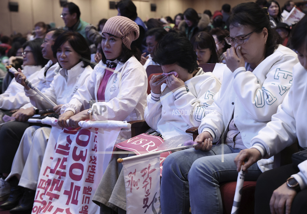 A South Korean supporter weeps after the South Korean city of Busan failed to win the right to host the 2030 World Expo