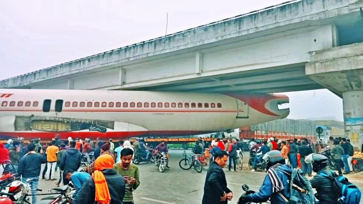 Airplane Stuck Under Flyover: