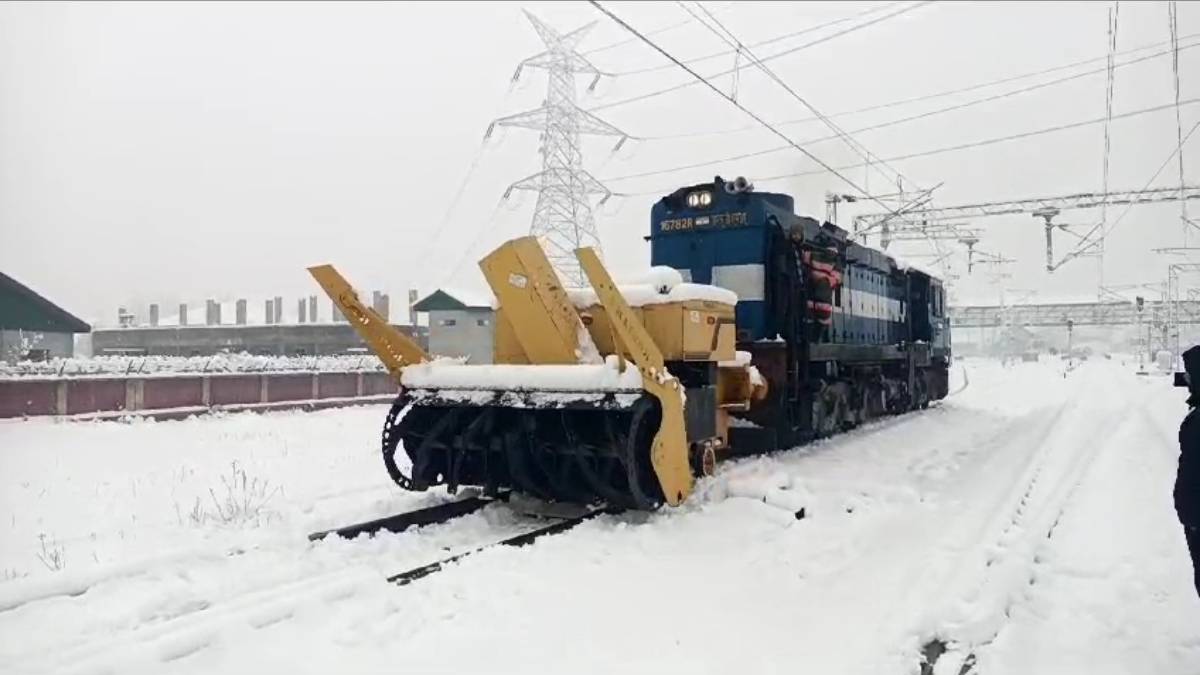 A snow-cutter removes snow accumulated on tracks