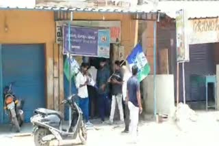 YSRCP_Leaders_With-Party_Flags_At_Liquor_Shops_in_Gutti