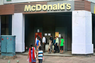 FDA officials in Noida collect food samples from McDonald's and Theobroma bakery following complaints of customers falling sick after consuming their products. Samples include palm oil, cheese, mayonnaise from McDonald's and pineapple cake from Theobroma.