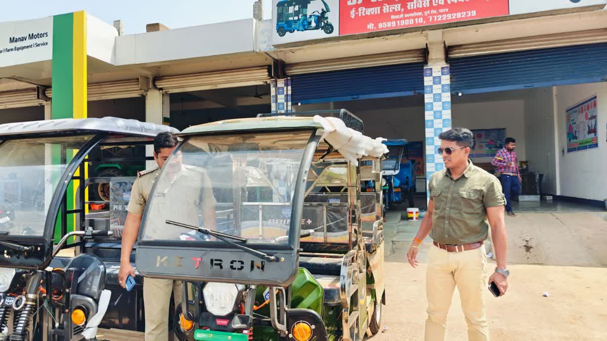 against E Rickshaw showroom in Patan