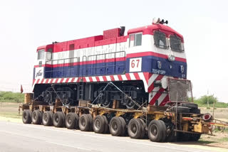 train engine on lorry