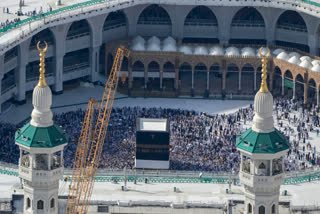 Billboards line the Umm Al Qura highway leading to the Grand Mosque in Mecca, displaying manicured public spaces, glass-fronted stores and sleek towers. It's part of a $26 billion project to bring more Muslims to the holy city's high-end hotels, residences, retailers and restaurants.