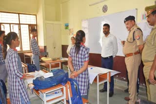 Police officials at Kendriya Vidyalaya in UP's Etah after 12 students faint due to heatstroke