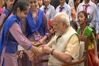 Delhi: Schoolgirls tie Rakhi to PM Modi on Raksha Bandhan