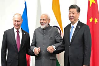 Russian President Vladimir Putin, Indian Prime Minister Narendra Modi and Chinese President Xi Jinping hold a meeting on the sidelines of the G20 summit in Osaka on June 28, 2019