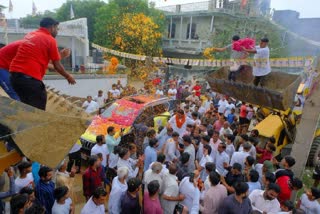 Bulldozers used to shower flowers in an election rally in Haryana