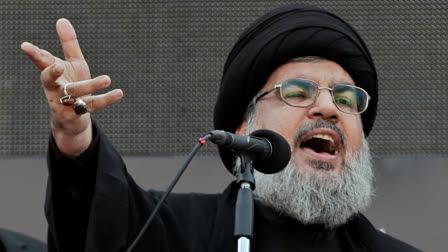 FILE - Hezbollah leader Sheik Hassan Nasrallah, speaks to the crowd in a rare public appearance during Ashura, that marks the death of Shiite Islam's Imam Hussein, in the suburbs of Beirut, Nov. 14, 2013.