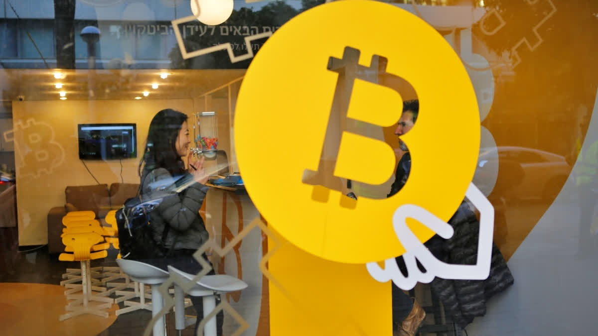 A woman buys Bitcoin at Bitcoin Change in Tel Aviv, Israel, on Jan. 8, 2018.