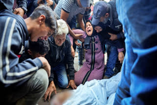 Palestinians mourn their relatives killed in the Israeli bombardment of the Gaza Strip at a hospital morgue in Deir al-Balah, Tuesday, Oct. 29, 2024.