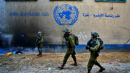 File - Israeli soldiers take position as they enter the UNRWA headquarters in Gaza.