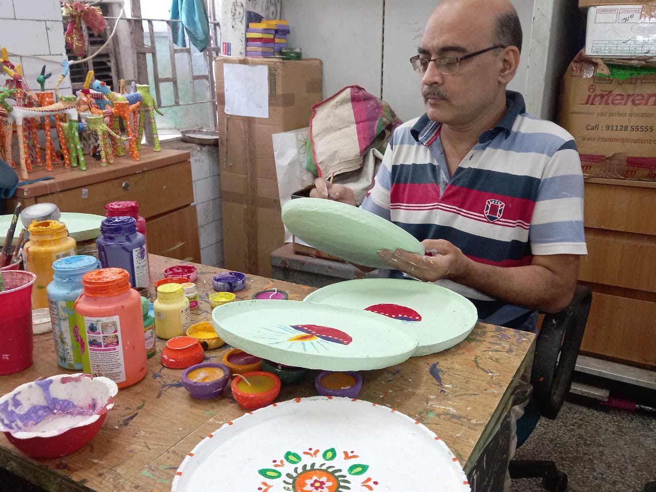 Disabled people are making candle stand from waste cigarette boxes on Diwali, they do something special on every festival