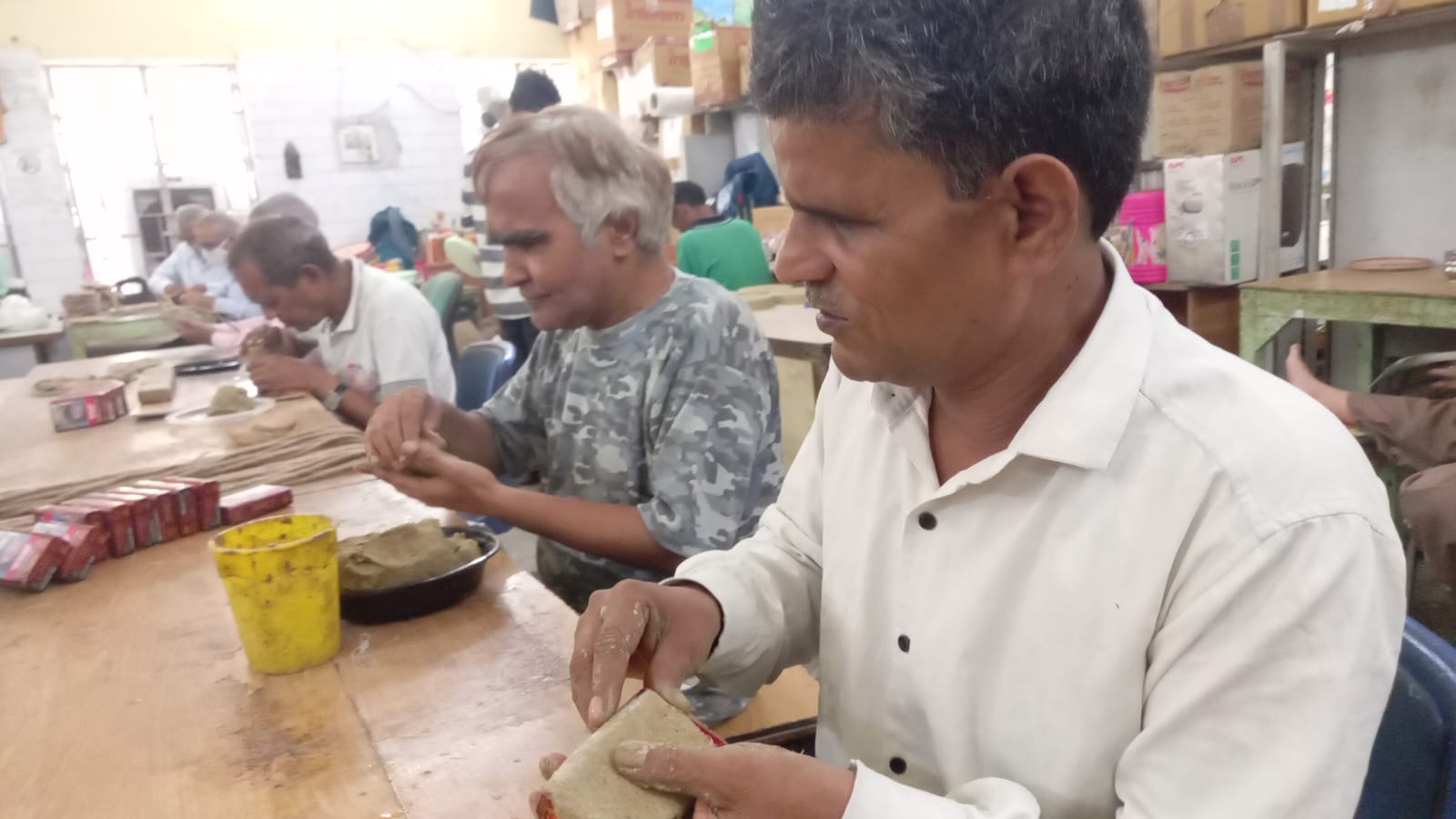 Disabled people are making candle stand from waste cigarette boxes on Diwali, they do something special on every festival