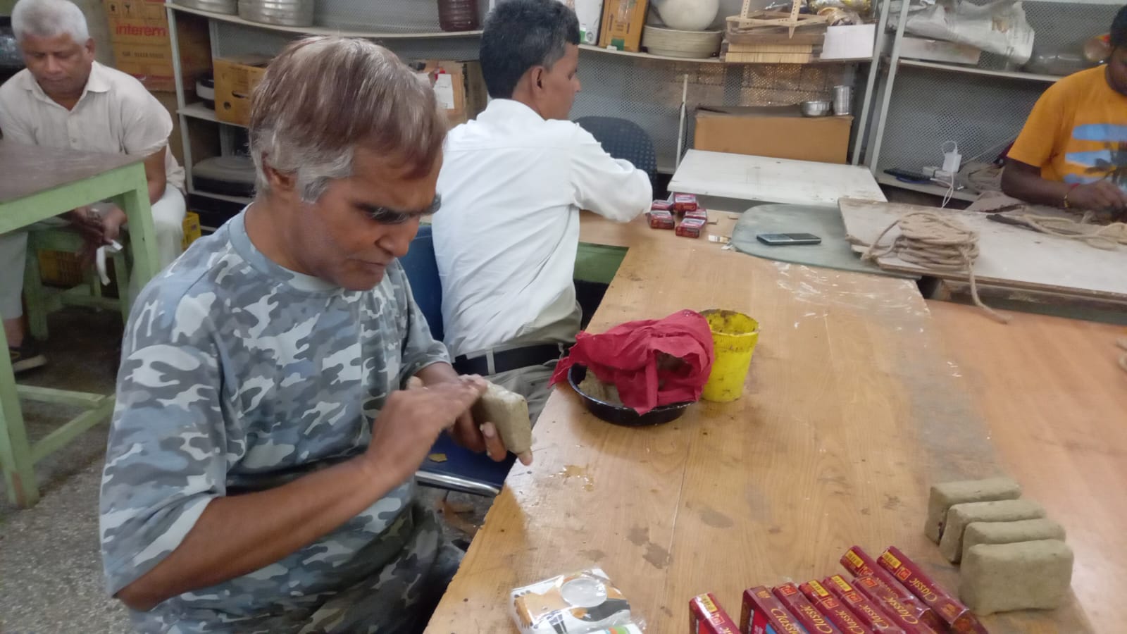 Disabled people are making candle stand from waste cigarette boxes on Diwali, they do something special on every festival