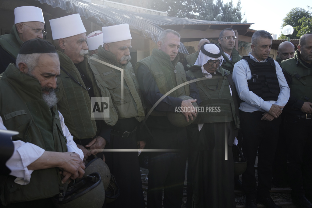 Faith leaders from the Druze, Muslim, Jewish and Christian communities hold an interfaith prayer at Kibbutz Kfar Azza