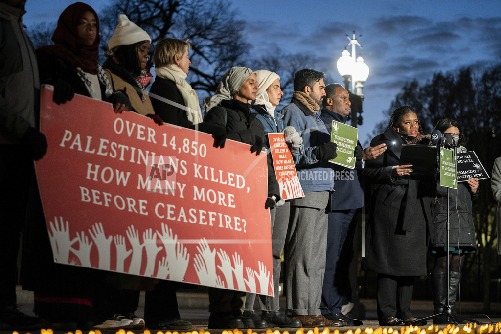 Rep. Jonathan Jackson, D-Ill., right, speaks alongside state legislators and faith leaders currently on hunger strike outside the White House to demand that President Joe Biden call for a permanent ceasefire in Gaza