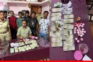 POLICE RAID GAMBLING DEN