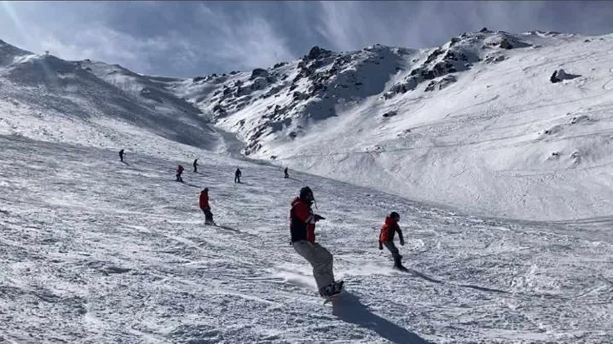 Skiers ski down the slopes of Gulmarg in Baramulla, J&K