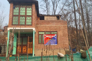 Anantnag police paste an attachment notice on the house of one of the drug peddlers on Monday