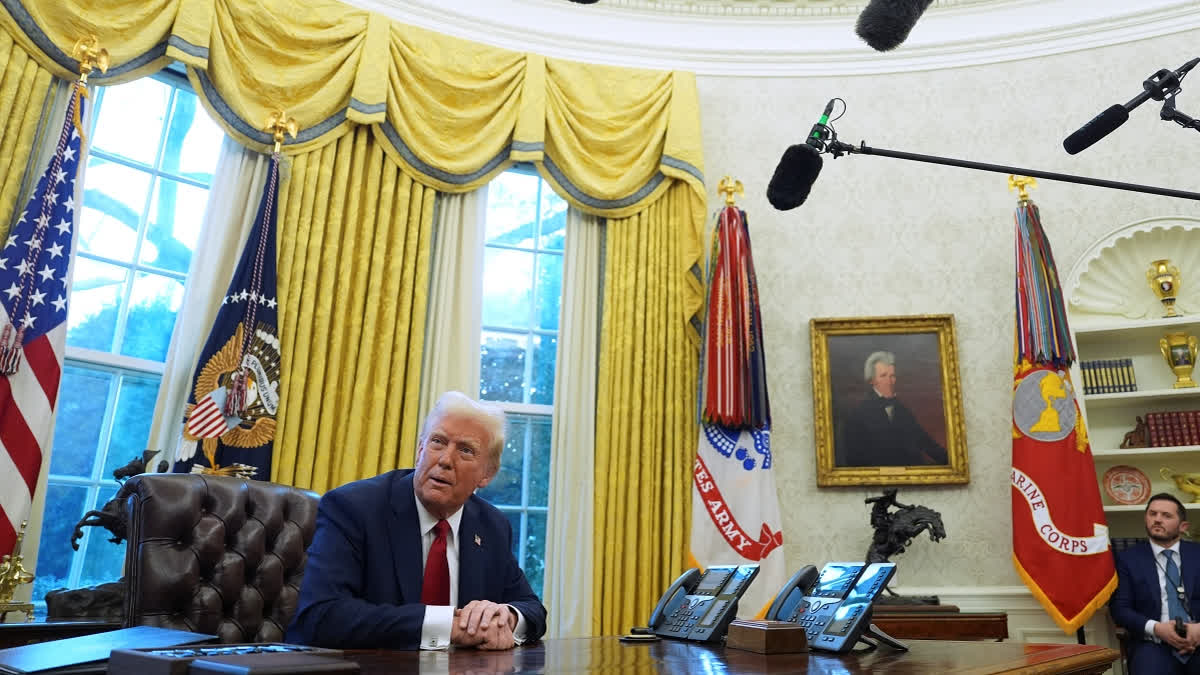 President Donald Trump listens to a question as he signs executive orders in the Oval Office at the White House, Thursday, Jan. 30, 2025, in Washington.