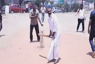 L MURUGAN PLAYING CRICKET WITH YOUTHS