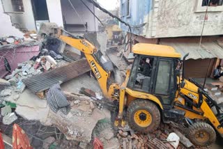 BULLDOZER ON ACCUSED HOUSE