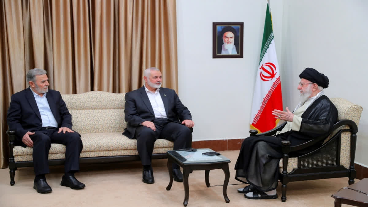 Iran's Supreme Leader Ayatollah Ali Khamenei, right, speaks with Hamas chief Ismail Haniyeh, center, and the leader of the Palestinian Islamic Jihad group Ziad Nakhaleh in a meeting in Tehran, Iran, Tuesday, July 30, 2024