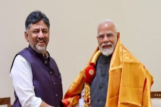 DK Shivakumar (Left) and PM Narendra Modi (Right)