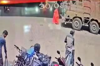 Lorry ran over an old woman who was standing to cross the road