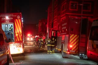 At least 58 people were either charred or were suffocated to death when a fire ripped through a multi-story building in Johannesburg that had been overtaken by homeless people, emergency services said Thursday.