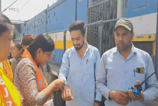 Watch: BJP leader tying the rakhi of the train driver and guard At Bathinda Railway Station