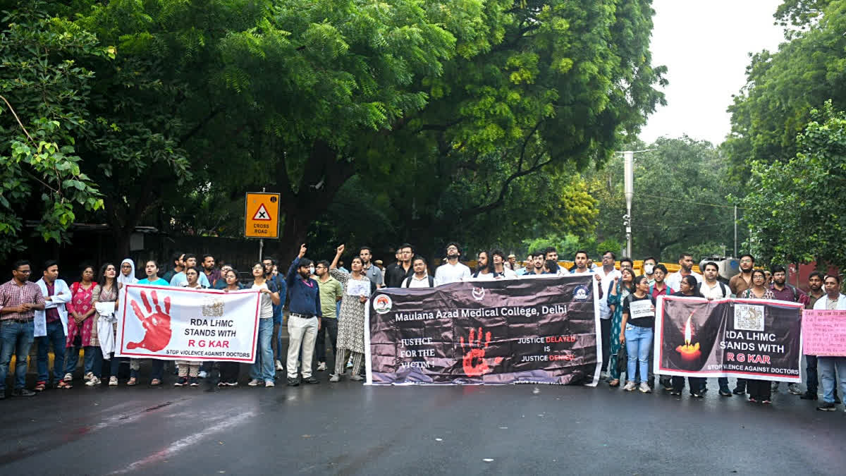 Doctors raise slogans as they stage a protest demanding justice against the alleged sexual assault and murder of a postgraduate trainee doctor of the Kolkata RG Kar Hospital, at Jantar Mantar in New Delhi on Friday.