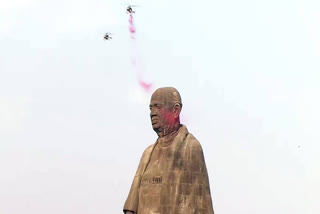 Flower petals being showered at the Statue of Unity by IAF choppers during the celebrations of National Unity Day to mark the birth annivarsary of Sardar Vallabhbhai Patel, at Ekta Nagar in Narmada district on Thursday.