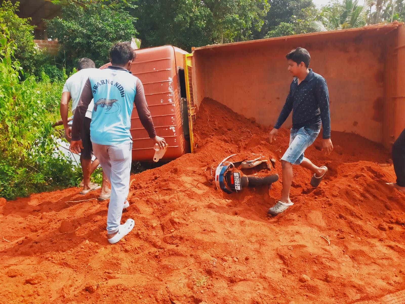 Lorry Overturned On Woman After Hit Scooty In Udupi