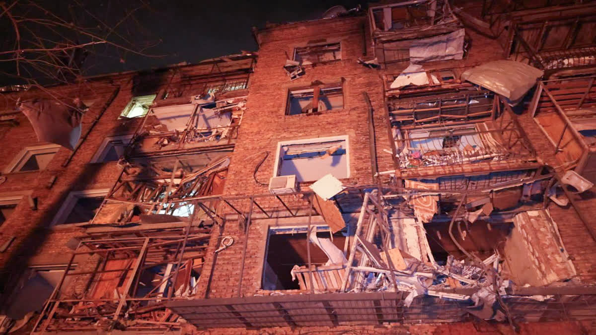 In this photo provided by the Ukrainian Emergency Service, an apartment building hit by a Russian missile is seen in Kharkiv, Ukraine, Saturday, Dec. 30, 2023. (Ukrainian Emergency Service via AP)