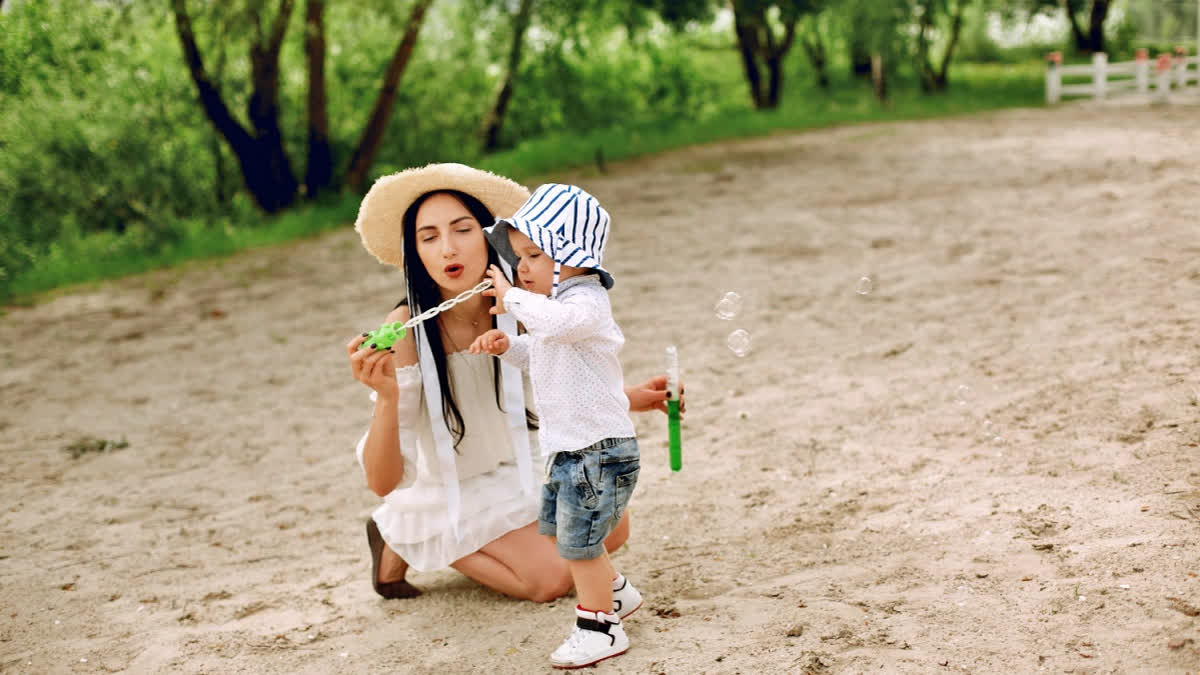 Woman travelling with her toddler son