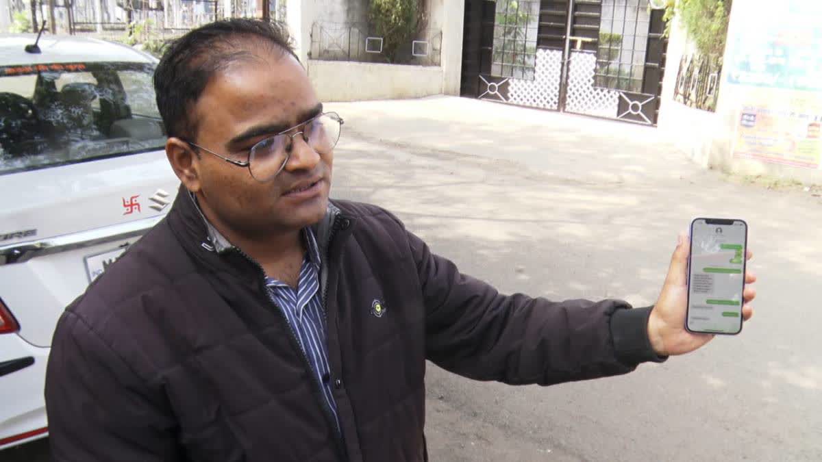 Anil Kumar Shivahre shows the hacked mobile phone