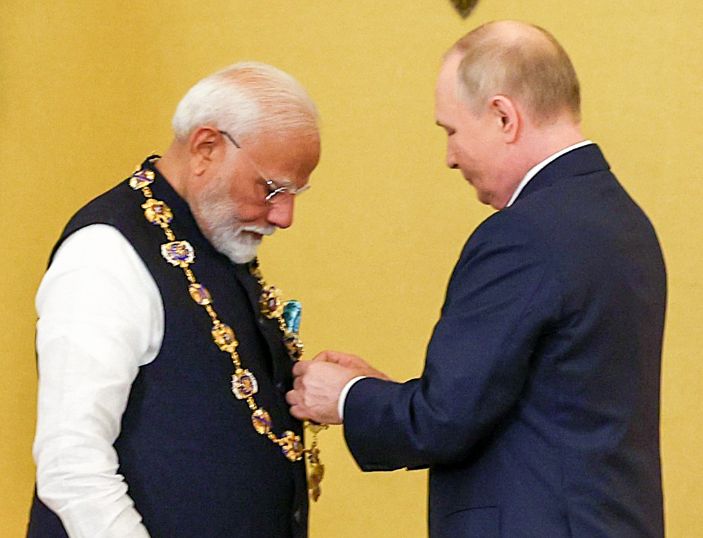 Prime Minister Narendra Modi receives the Order of St Andrew the Apostle the First-Called, Russia's highest civilian honour, by Russian President Vladimir Putin, at St Catherine's Hall, in Moscow