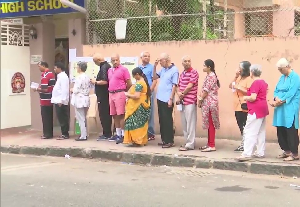 Voters queue outside polling booth number 40 & 41 in South Mumbai