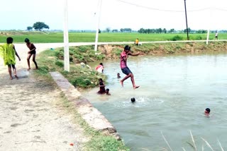 children showing stunt in tati river