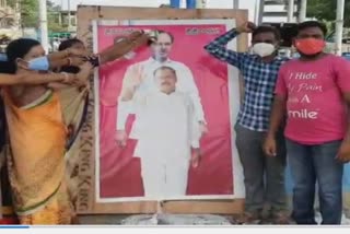 Anointing private teachers to KCR photo in jayashanker Bhupalpally district