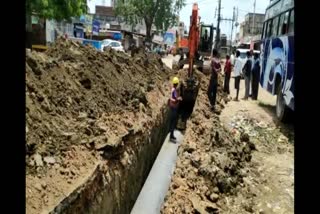 Pits dug on roads to put pipeline