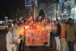 BJP Yuva Morcha take out candle march over increasing molestation case in Ramgarh 