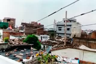 People of the colony protest against high-tension wire from the roof