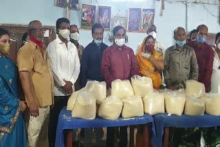 rice and masks distribution to ganga putrulu