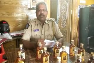 seized liquor bottles at addanki 