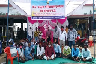 Bus drivers-operators association staged a sit-in at the bus stand