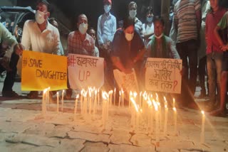 rjd workers oppose hathras case by candle march